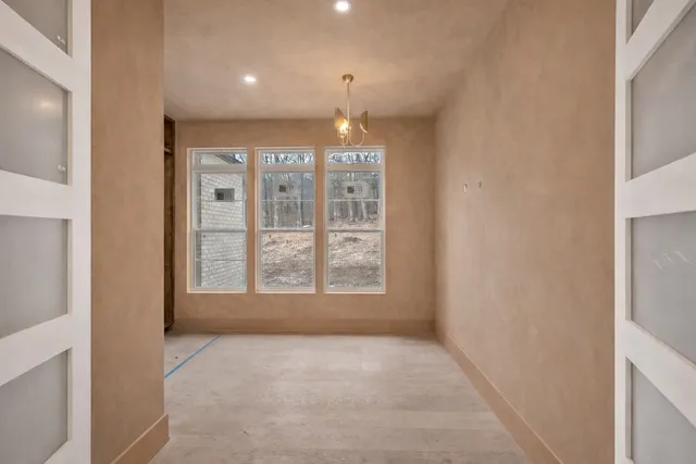 a bathroom with a toilet a sink and a mirror