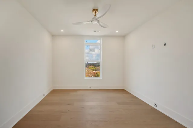 a bathroom with a toilet sink and shower
