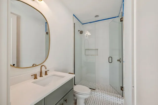 a view of a balcony with table and chairs
