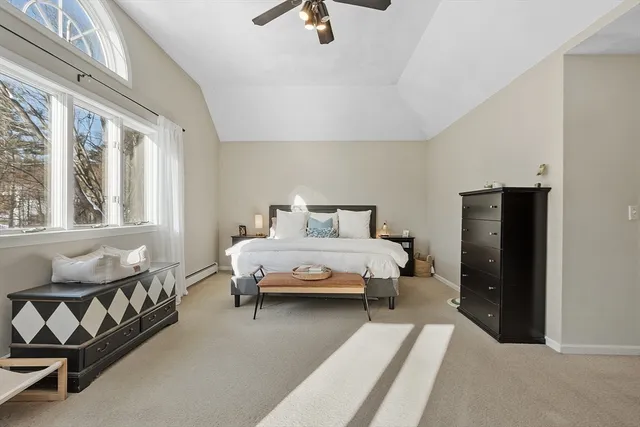 a bedroom with a bed and a couch