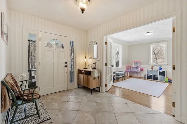 a living room with furniture and white walls