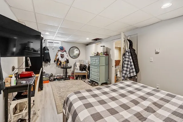 a bed room with a bed and a chair