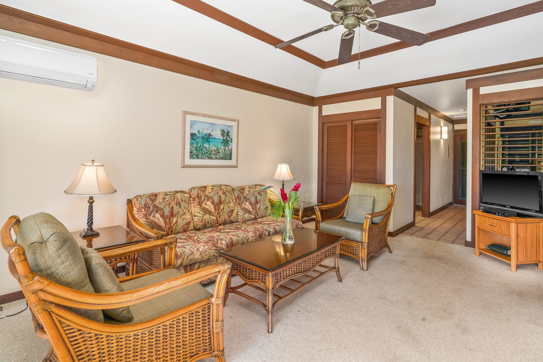 2253 Poipu Road, Unit 109 Koloa, HI 96756 - Photo 7 of 12 a living room with furniture a ceiling fan and a window