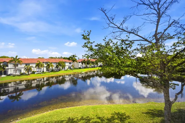 a view of a lake with a yard