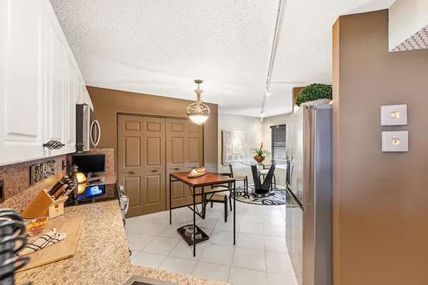 a view of a livingroom with furniture and a window