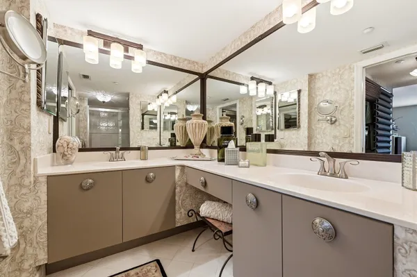 a bathroom with a sink vanity and mirror