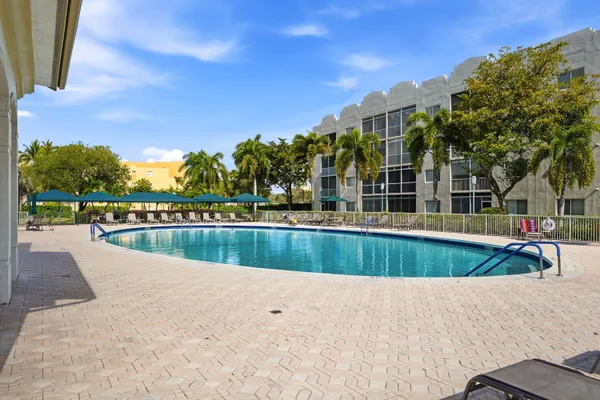 a view of swimming pool with a patio
