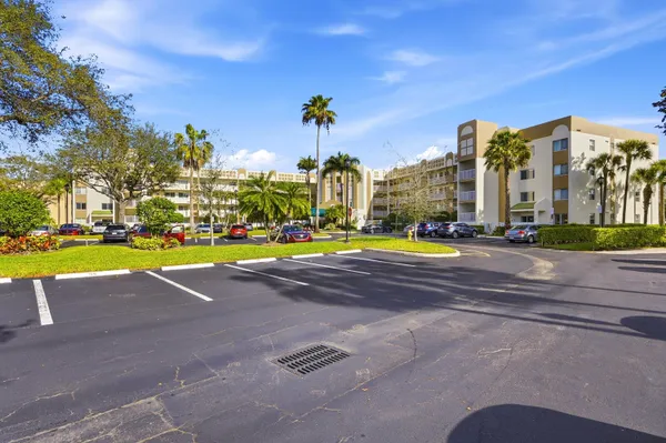a view of outdoor space with swimming pool and brick buildings