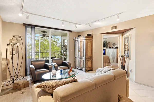 a living room with furniture and a large window