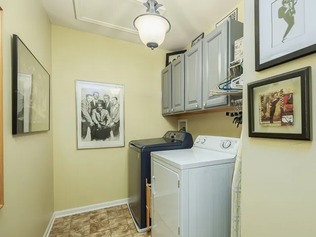 a view of a storage & utility room with a washer dryer