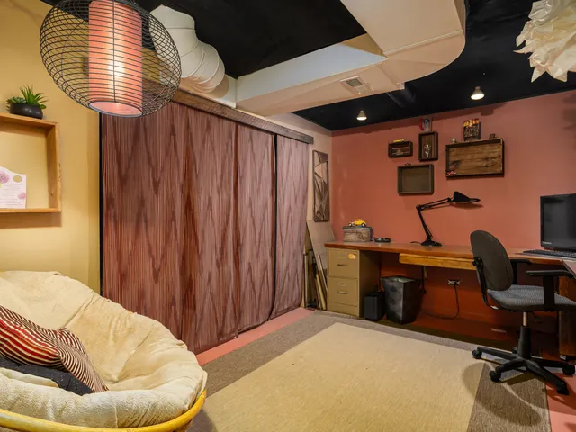 a workspace with furniture and window