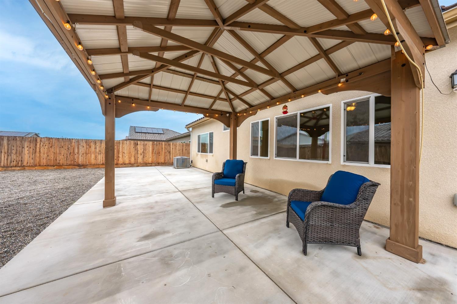 742 Strada Street Lemoore, CA 93245 - Photo 26 of 40 a view of a porch with furniture and a rug