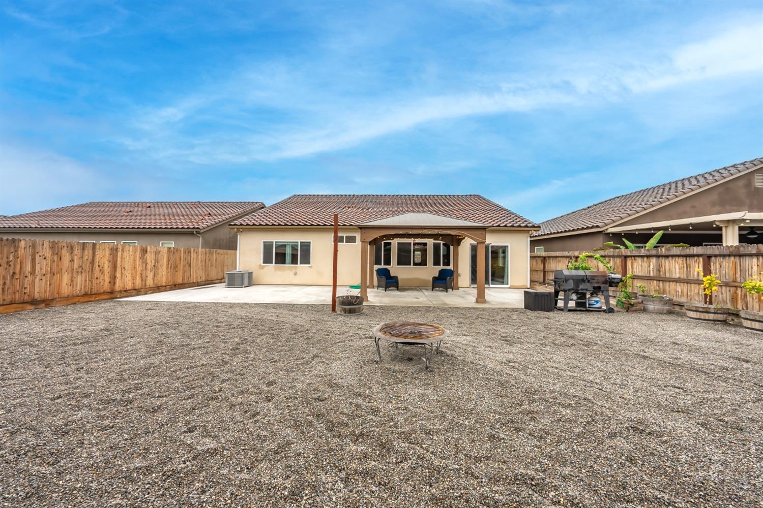 742 Strada Street Lemoore, CA 93245 - Photo 28 of 40 a front view of a house with a garden