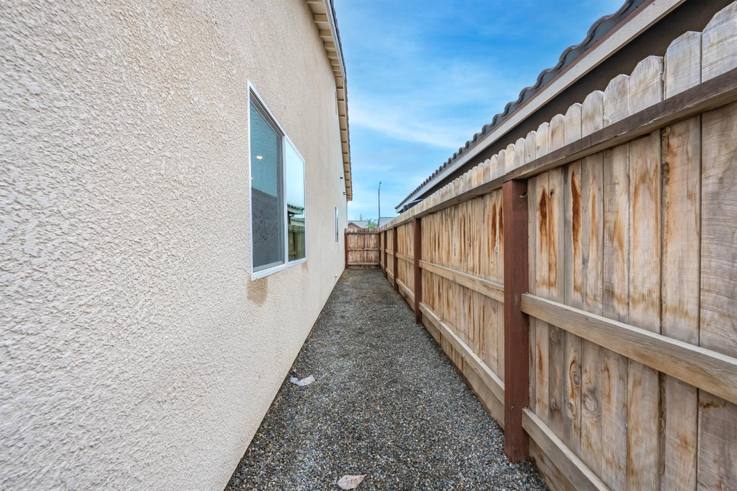 742 Strada Street Lemoore, CA 93245 - Photo 31 of 40 a view of balcony with wooden floor and stairs