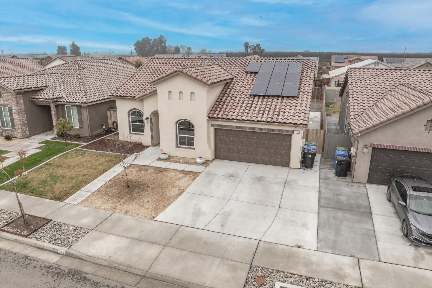 742 Strada Street Lemoore, CA 93245 - Photo 33 of 40 a view of a white building with many windows