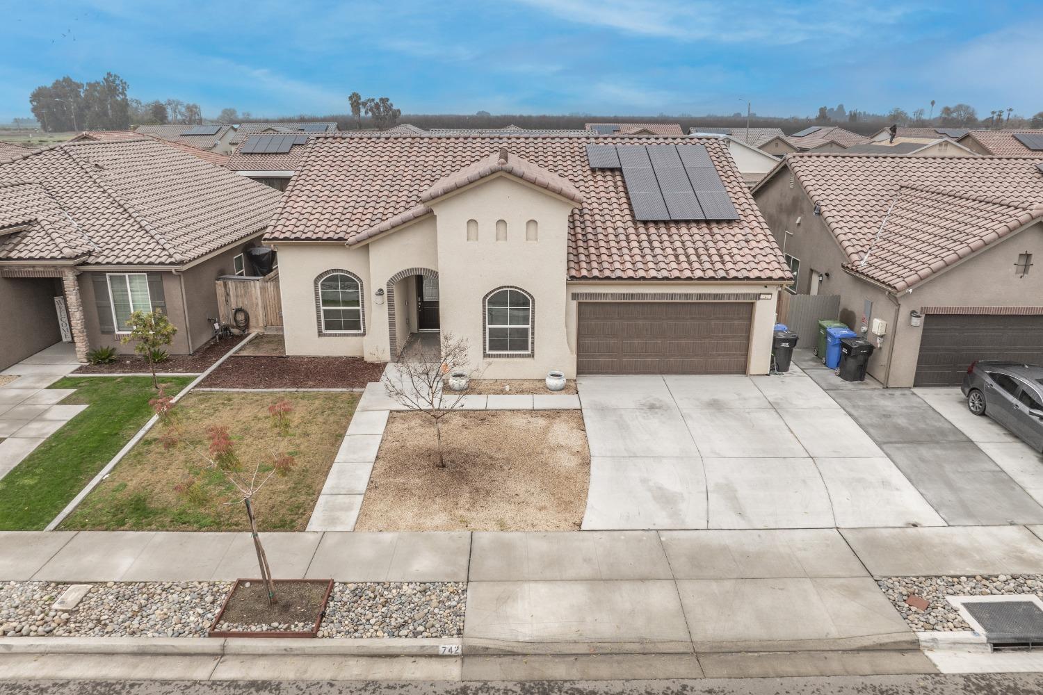 742 Strada Street Lemoore, CA 93245 - Photo 34 of 40 front view of a house with a yard