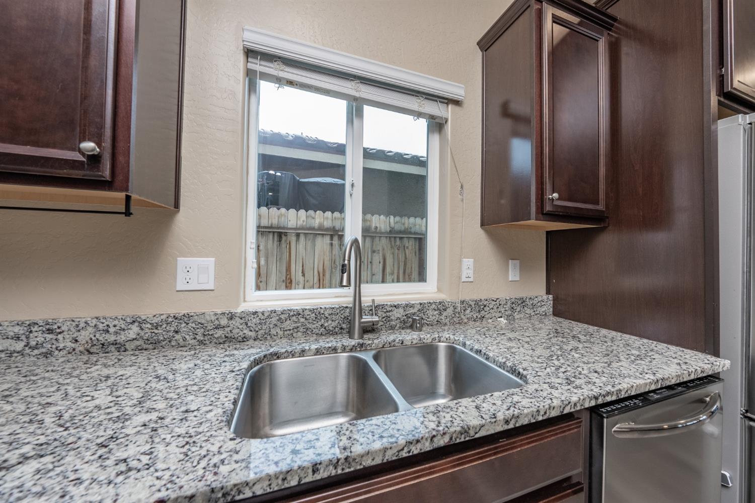 742 Strada Street Lemoore, CA 93245 - Photo 10 of 40 a kitchen with a sink and a window