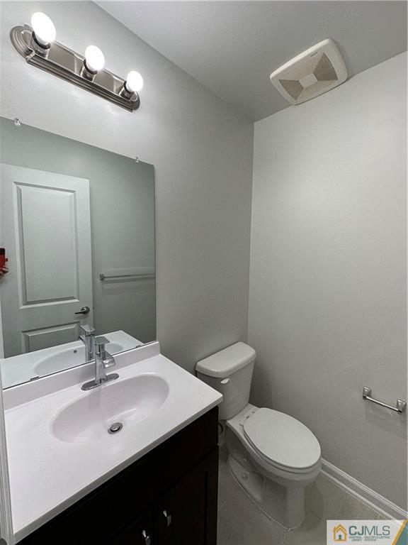 3703 Hana Road Edison, NJ 08817 - Photo 3 of 55 a bathroom with a sink and a mirror