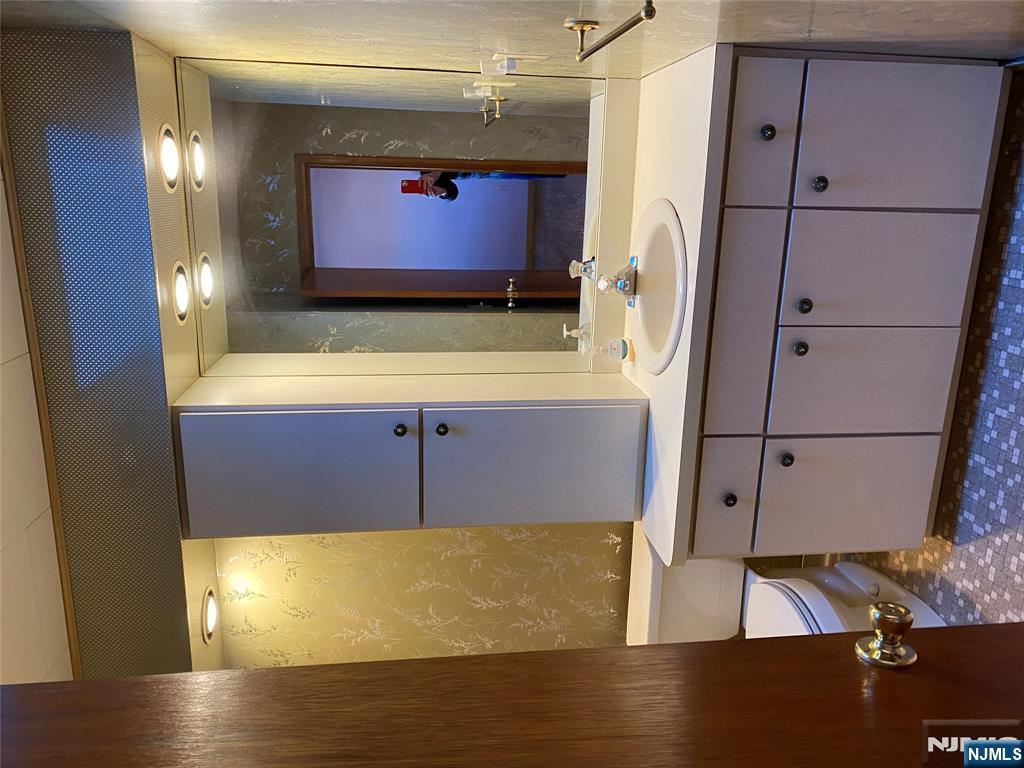 95 Atkins Terrace East Rutherford, NJ 07073 - Photo 14 of 31 a bathroom with a double vanity sink and mirror