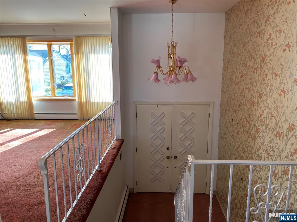 95 Atkins Terrace East Rutherford, NJ 07073 - Photo 19 of 31 a view of a hallway with wooden floor and stairs