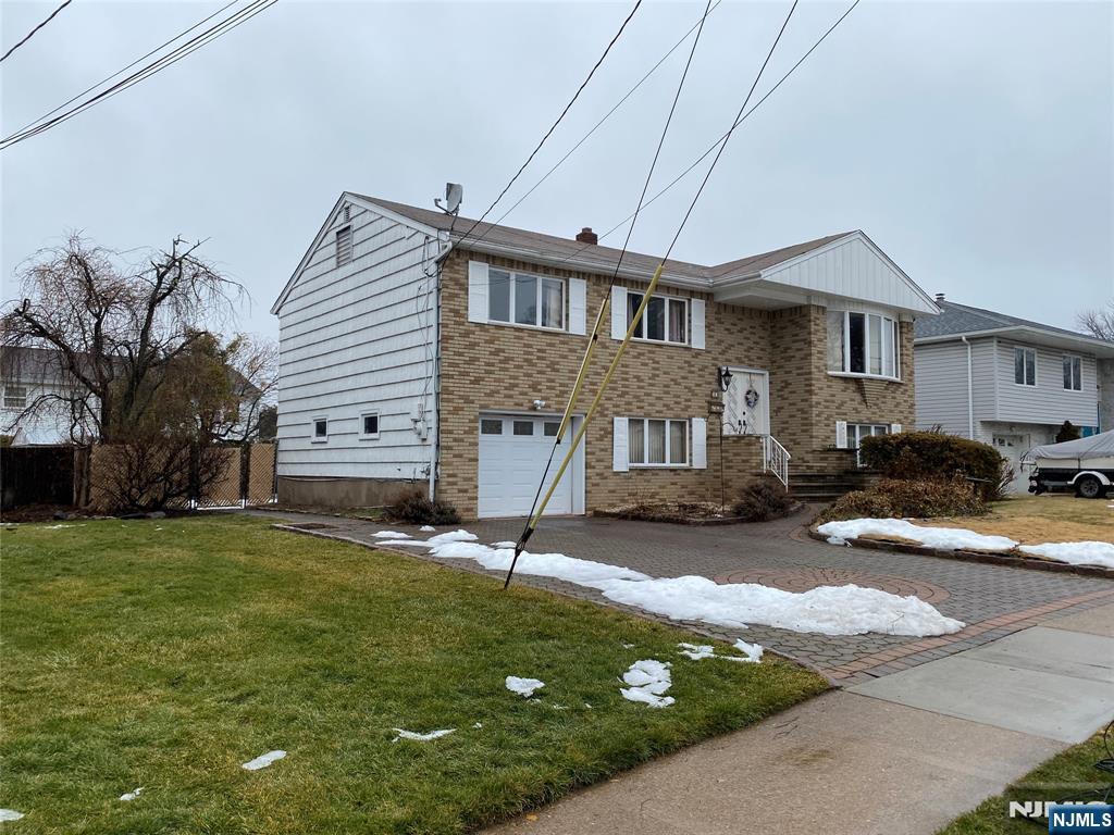 95 Atkins Terrace East Rutherford, NJ 07073 - Photo 2 of 31 a view of a house with a patio