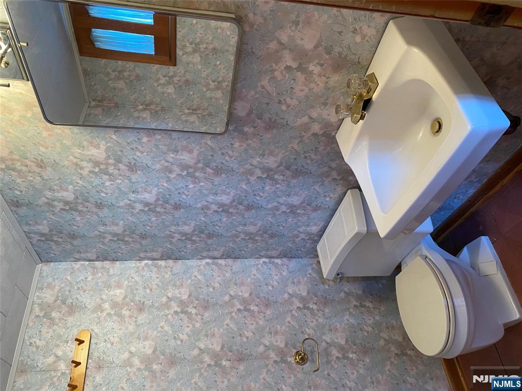 95 Atkins Terrace East Rutherford, NJ 07073 - Photo 23 of 31 a bathroom with a sink and a toilet