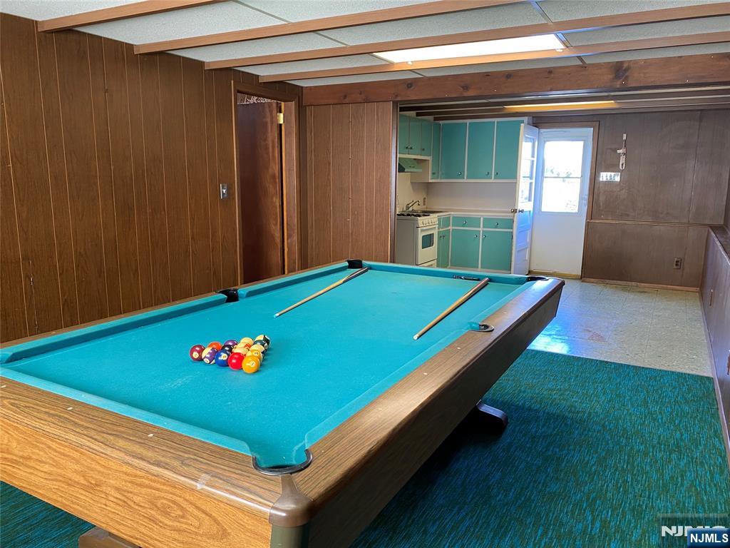 95 Atkins Terrace East Rutherford, NJ 07073 - Photo 26 of 31 a room with pool table and paintings on the wall