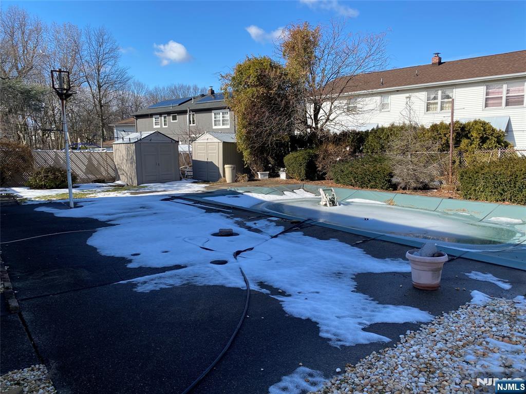 95 Atkins Terrace East Rutherford, NJ 07073 - Photo 28 of 31 a backyard of a house with table and chairs