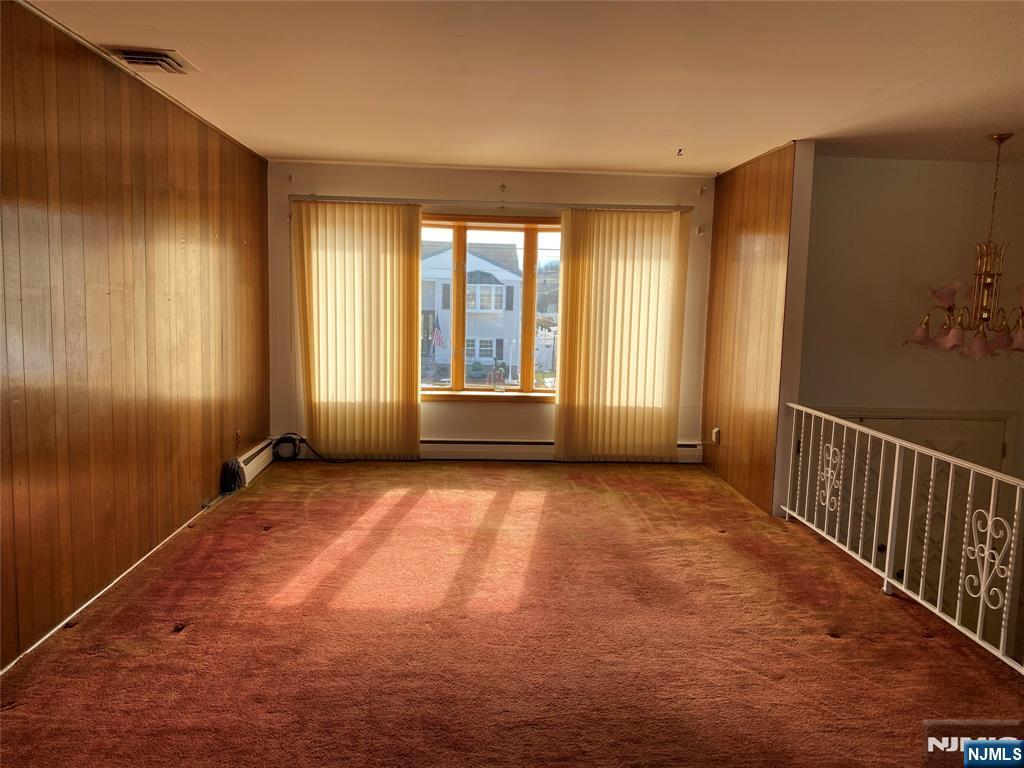 95 Atkins Terrace East Rutherford, NJ 07073 - Photo 4 of 31 a view of an empty room with a window