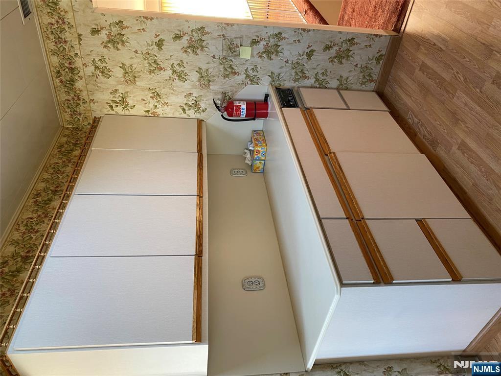 95 Atkins Terrace East Rutherford, NJ 07073 - Photo 9 of 31 a kitchen with a sink and a cabinets