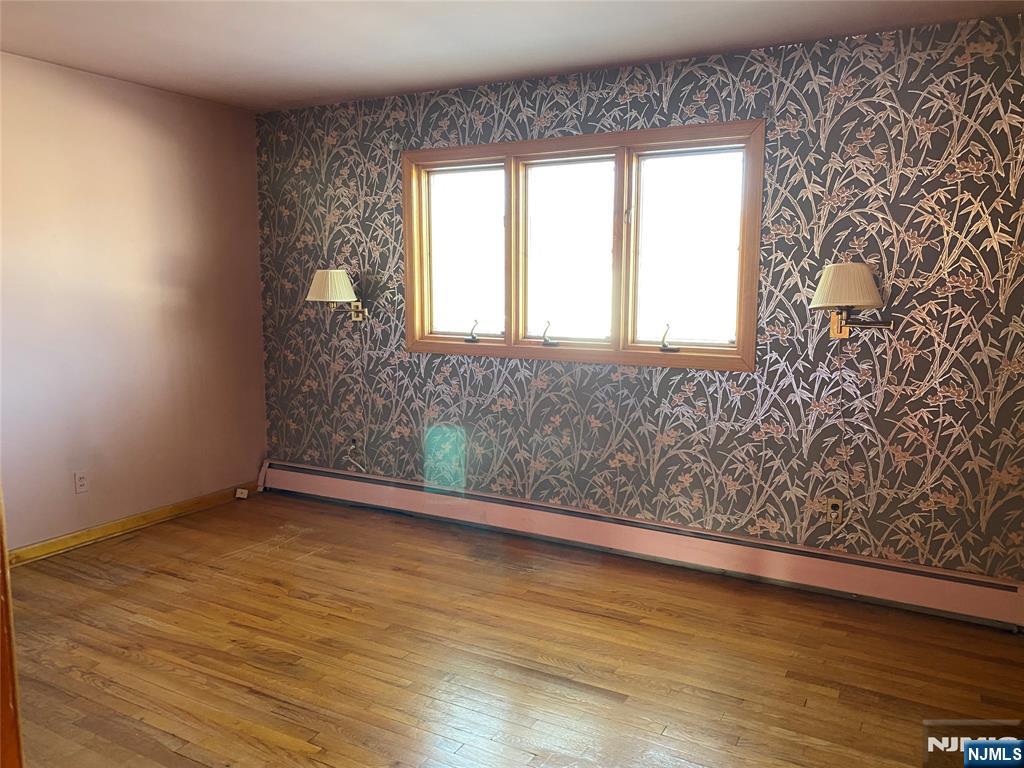 95 Atkins Terrace East Rutherford, NJ 07073 - Photo 10 of 31 wooden floor in an empty room with a window