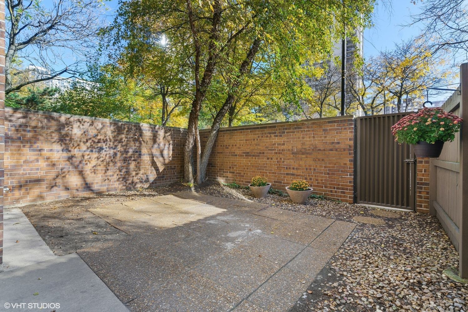 Undisclosed Address Chicago, IL 60610 - Photo 2 of 12 a backyard of a house with plants and trees