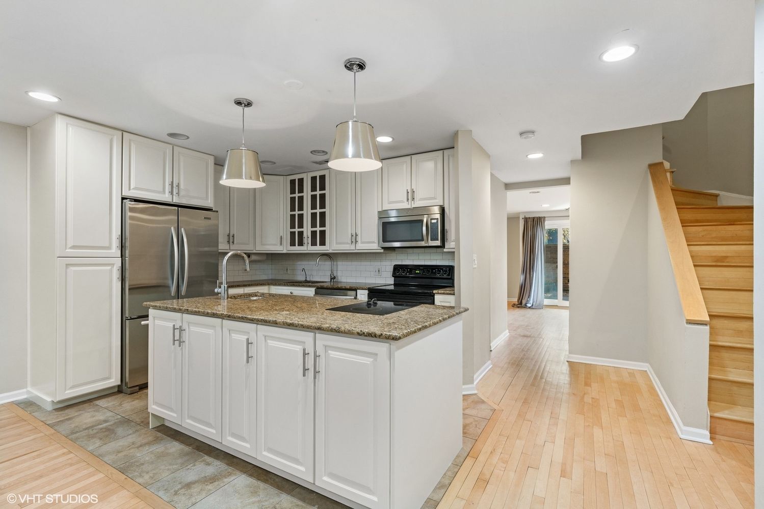 Undisclosed Address Chicago, IL 60610 - Photo 4 of 12 a kitchen with stainless steel appliances granite countertop a refrigerator a stove and a wooden floors