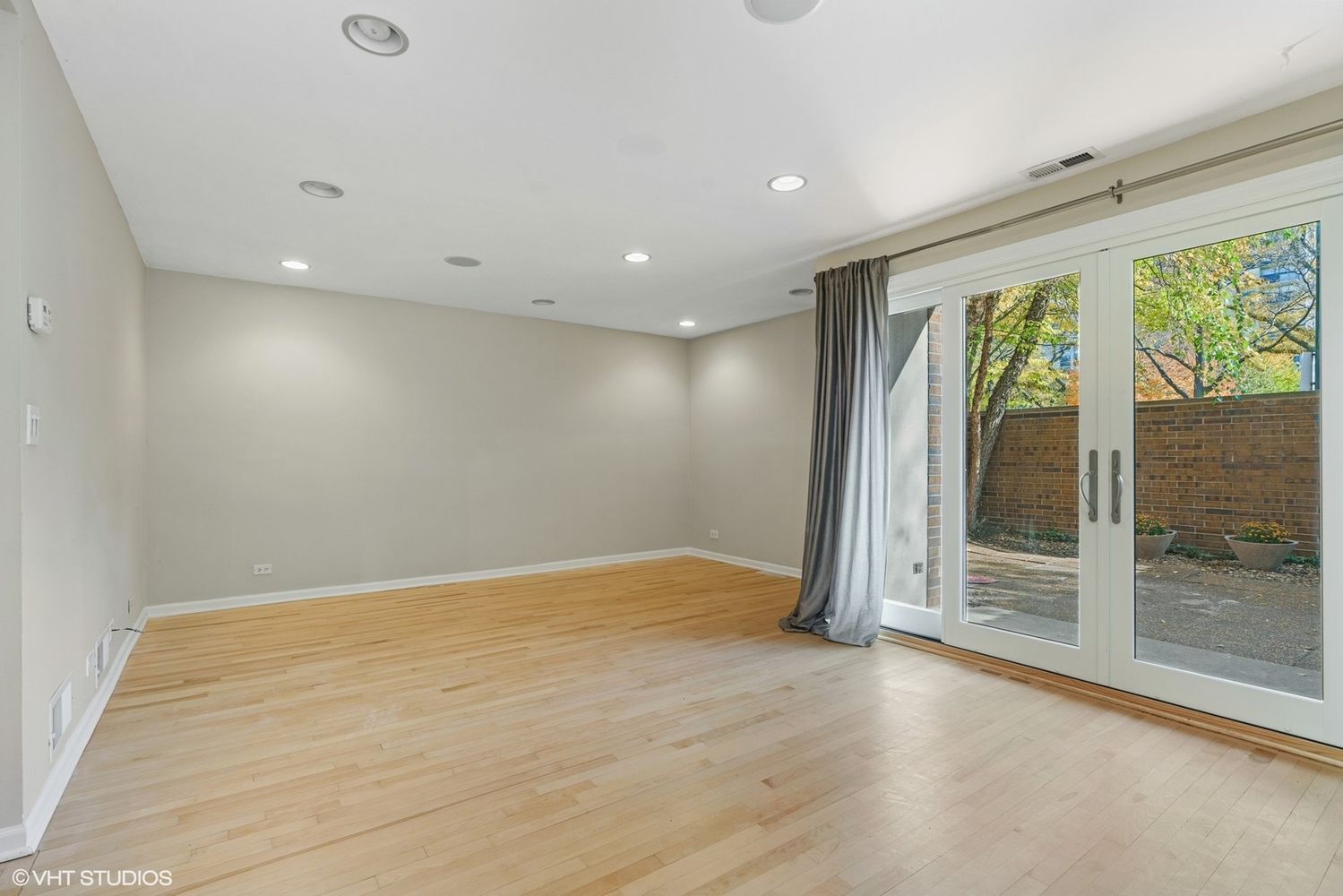 Undisclosed Address Chicago, IL 60610 - Photo 7 of 12 an empty room with wooden floor and door
