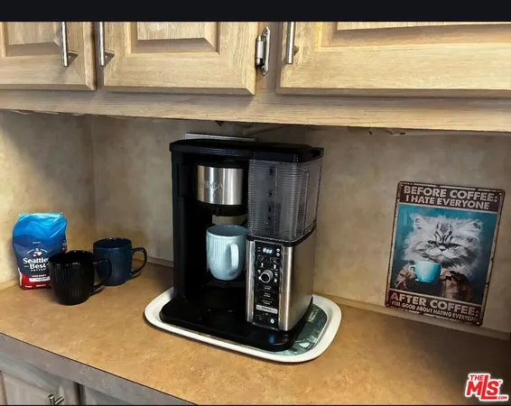 a kitchen with a stove and a microwave