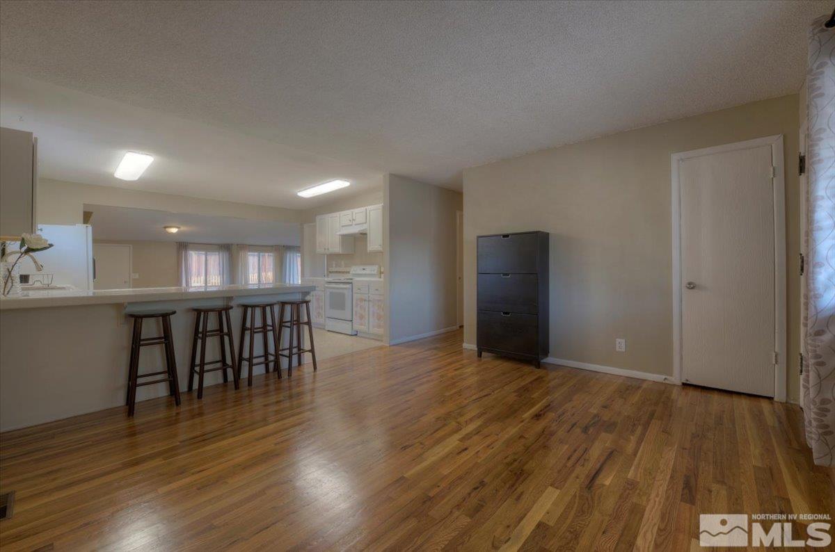 3451 Rauscher Drive Reno, NV 89503 - Photo 11 of 29 a view of a room with wooden floor kitchen and windows