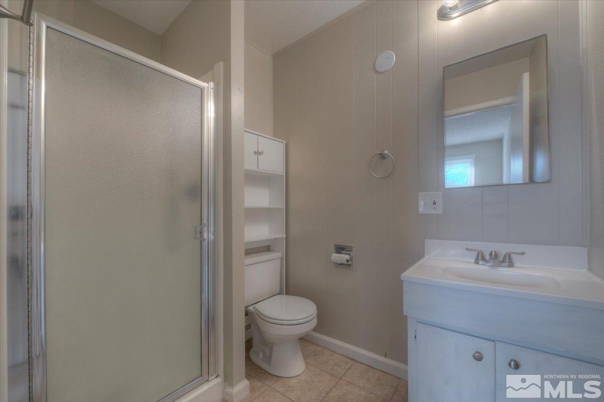 3451 Rauscher Drive Reno, NV 89503 - Photo 20 of 29 a bathroom with a toilet sink and shower