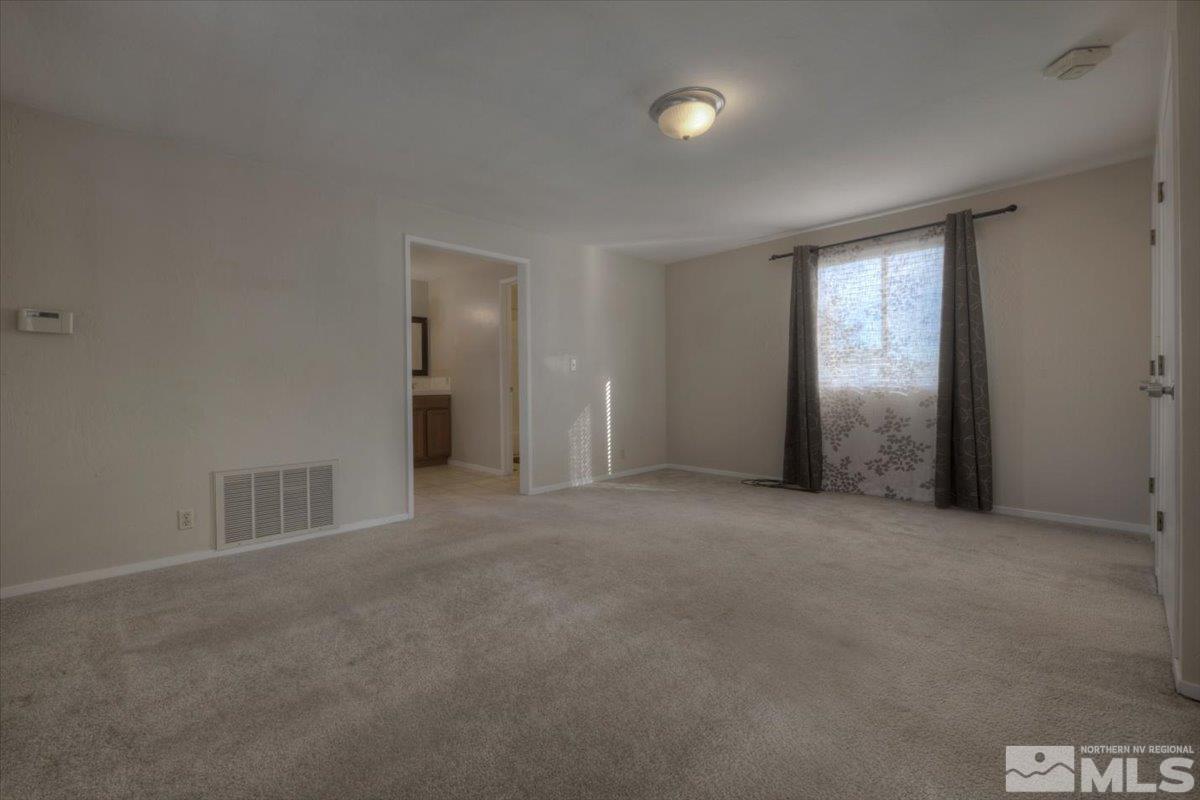 3451 Rauscher Drive Reno, NV 89503 - Photo 23 of 29 an empty room with closet and a window