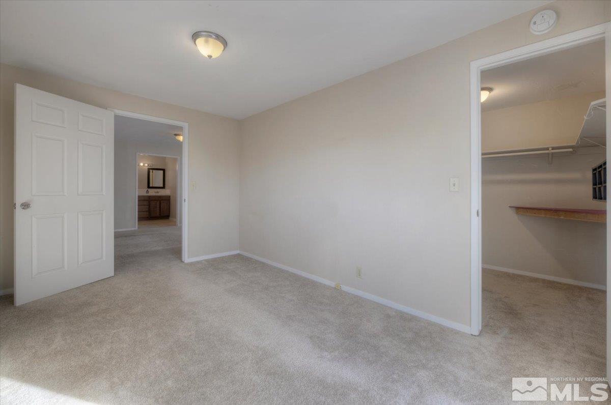 3451 Rauscher Drive Reno, NV 89503 - Photo 24 of 29 an empty room with an entryway and an empty room