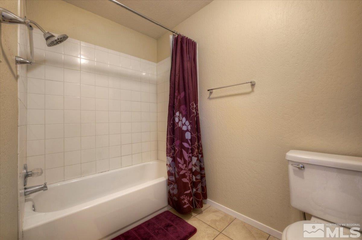 3451 Rauscher Drive Reno, NV 89503 - Photo 27 of 29 a bathroom with a bathtub and a shower
