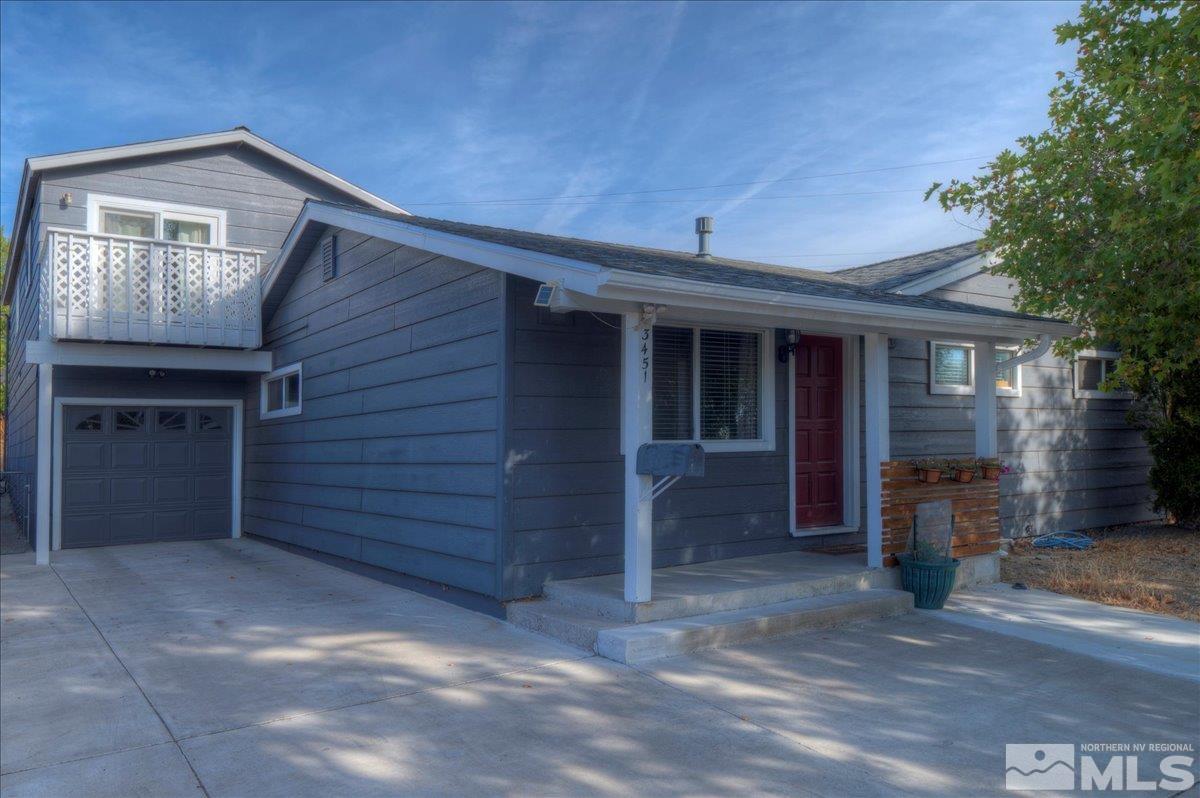 3451 Rauscher Drive Reno, NV 89503 - Photo 5 of 29 a front view of a house with a garage