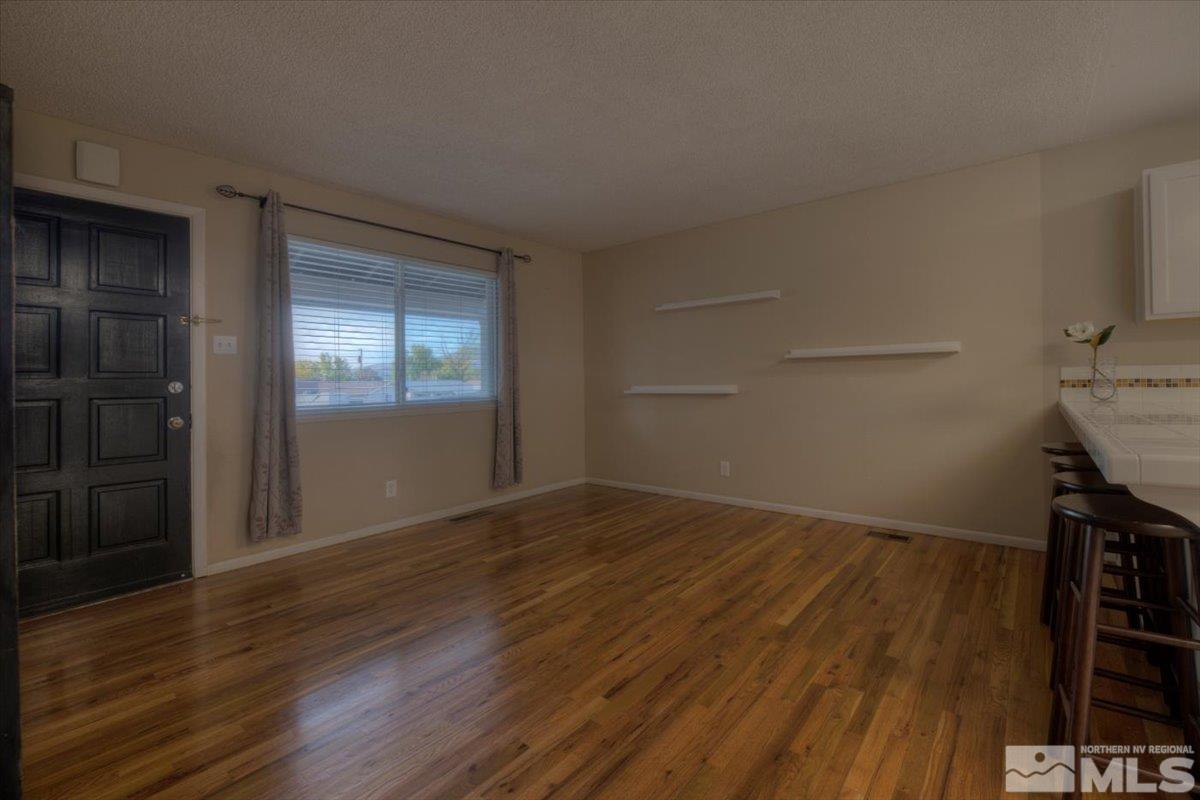 3451 Rauscher Drive Reno, NV 89503 - Photo 10 of 29 a view of empty room with wooden floor and fan