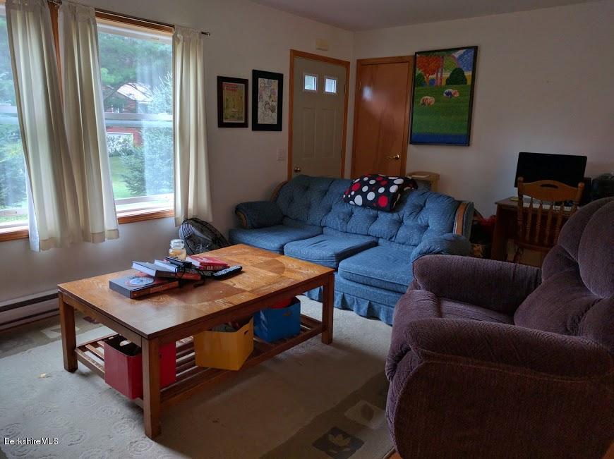 13 A Glendale Middle Road Stockbridge, MA 01262 - Photo 4 of 11 a living room with furniture and a flat screen tv