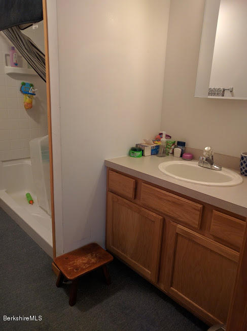 13 A Glendale Middle Road Stockbridge, MA 01262 - Photo 7 of 11 a room with a sink and a mirror