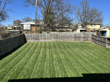 a view of yard with swimming pool