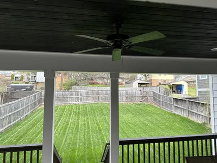 a view of a porch and a yard