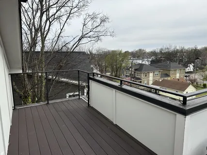a view of a balcony with chairs