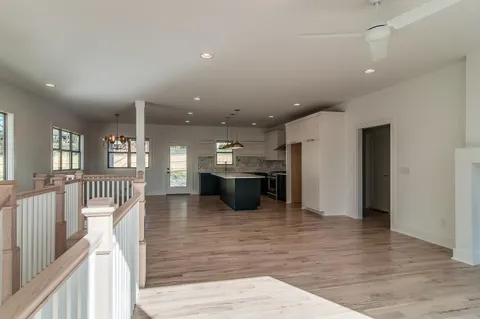 a lobby with furniture and a wooden floor