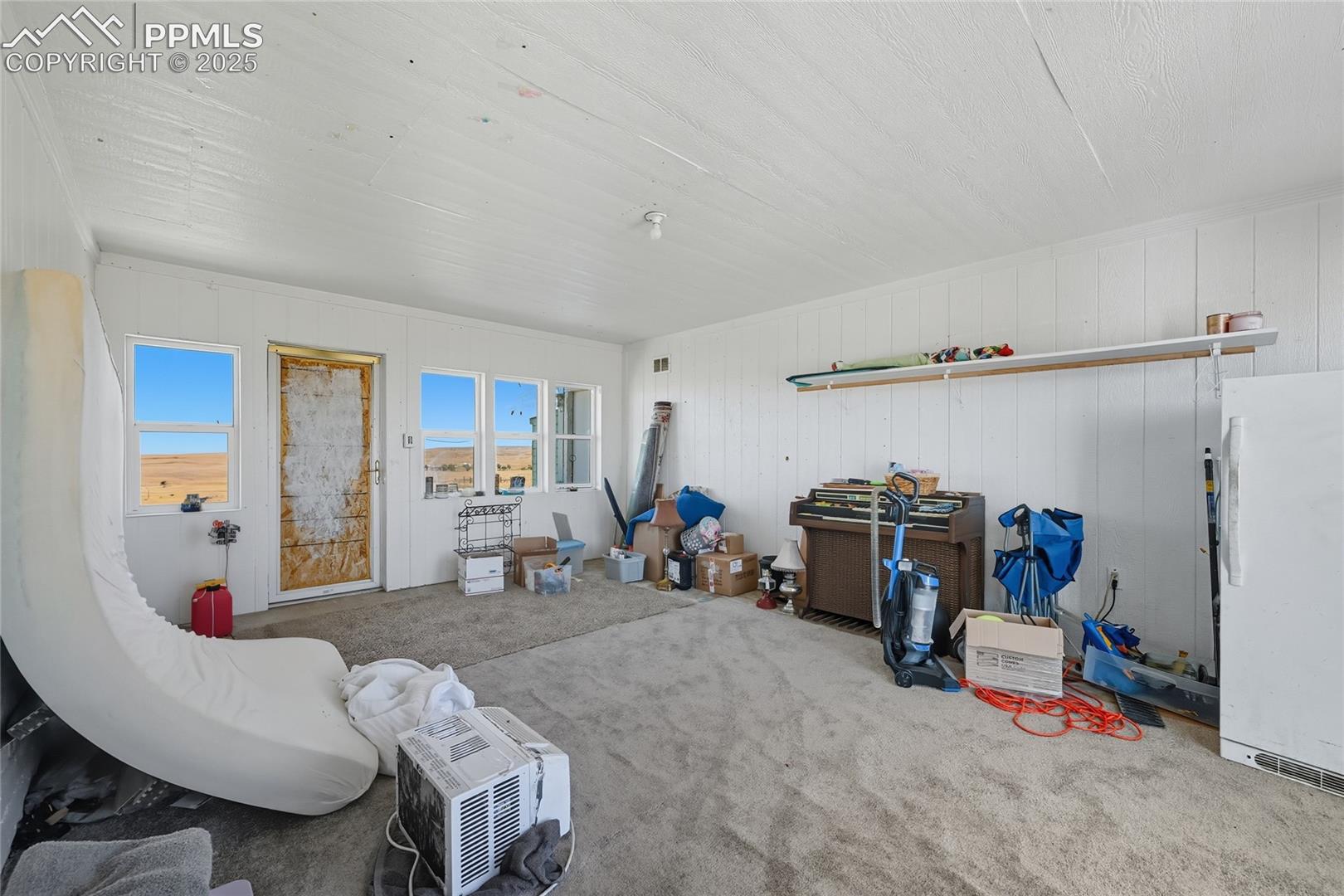 16595 North Yoder Road Calhan, CO 80808 - Photo 8 of 28 View of carpeted living area