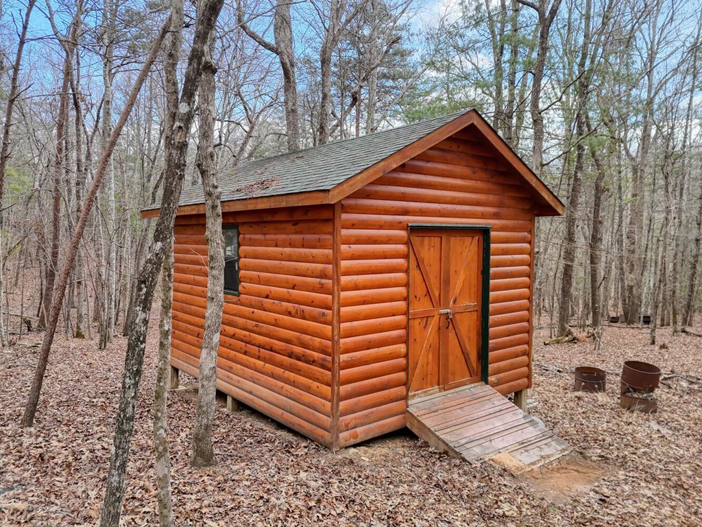 180 Shepherds Ridge Morganton, GA 30560 - Photo 12 of 66 a front view of a house with garden